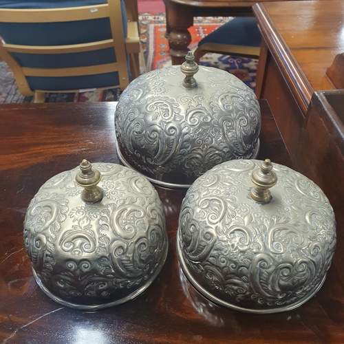 817 - A lovely set of three graduated serving Dishes with embossed lids.  Largest H 21 x D 22 cm approx.