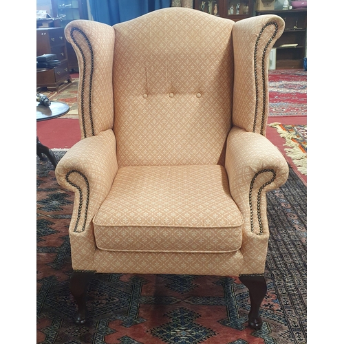 821 - A good Pink ground Wingback Armchair on cabriole supports along with a Pouffe.
BH 100, SH 45 x W 82 ... 