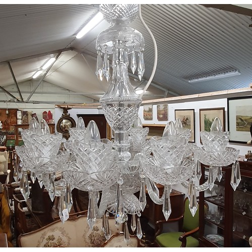 943 - A good eight branch Chandelier with crystal drops. (ensuite to lot 324). H 75  x D 73 cm approx.