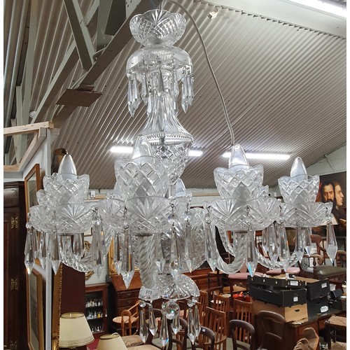 943 - A good eight branch Chandelier with crystal drops. (ensuite to lot 324). H 75  x D 73 cm approx.