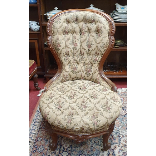 39 - A 19th Century Mahogany showframe Salon Chair with deep buttoned back and tapestry style upholstered... 