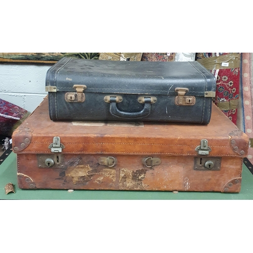 40 - A good 19th Century Leather Suitcase along with a black example and a green shipping trunk.
Largest ... 