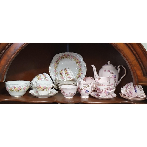 54 - A pink ground Tuscan China Coffee set along with a Coulport Marilyn part teaset.