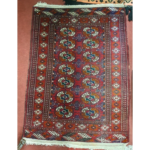 96 - A red ground Rug with repeating central medallion design and multi borders. Mehdi 125 x 87 cm approx... 