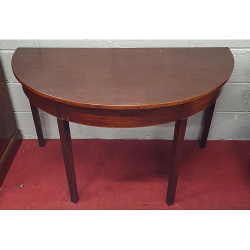 120 - A Georgian Mahogany half moon Table on square tapered supports. D 59 x H 73 cm approx.