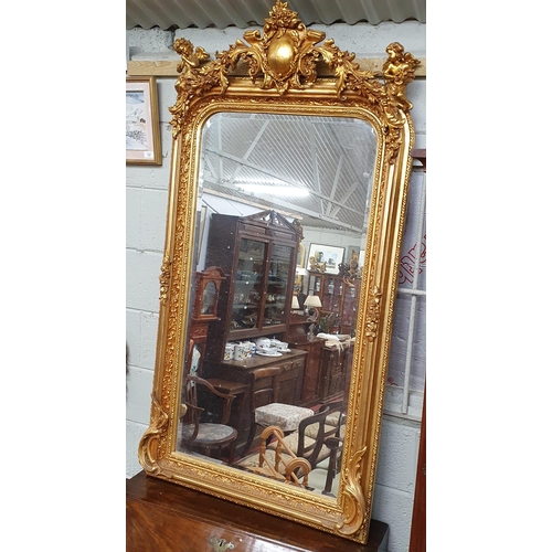 149 - A good Timber and Plaster Gilt overmantel Pier Mirror with bevelled mirror glass with cartouche top ... 