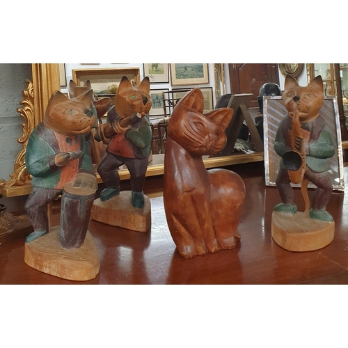 246 - A group of Timber musical Cats along with another.  H 27 cm approx.