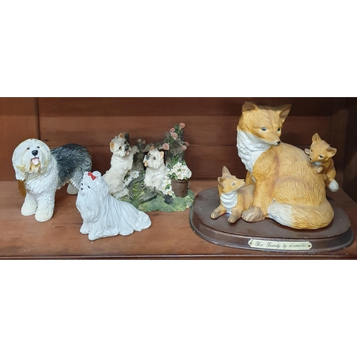 254 - A shelf of Animal Figures to include dogs, sheep and foxes.