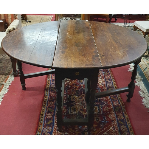 279 - A good 18th Century Oak provincial gate legged Table of large size.  H 75 x 140 x 120 cm approx.