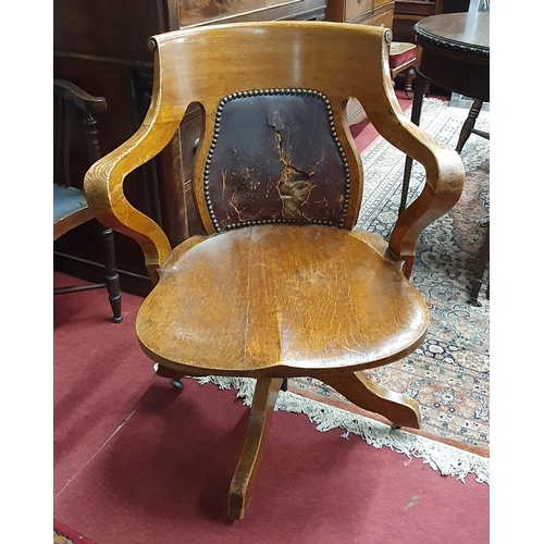 283 - A 19th Century Oak Office Chair with hardwood seat on swivel support. 
 SH 43 x 63 x 58 cm approx.