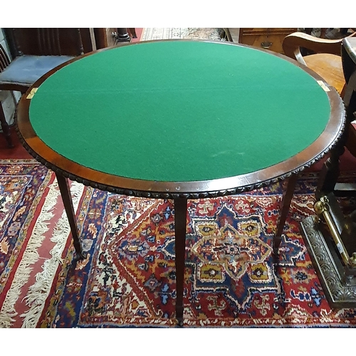 286 - A good late 19th early 20th Century Mahogany half moon Foldover Table with egg and dart moulded edge... 