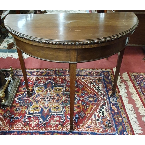 286 - A good late 19th early 20th Century Mahogany half moon Foldover Table with egg and dart moulded edge... 