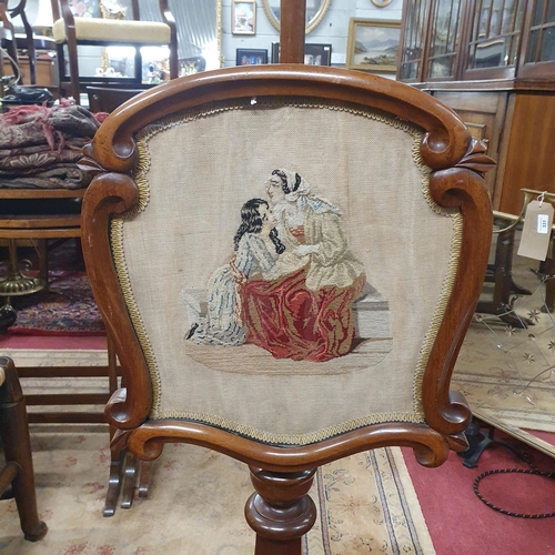 289 - An early 19th Century Mahogany Pole Screen with tapestry insert on platform base.
H 153 x W 36 cm ap... 