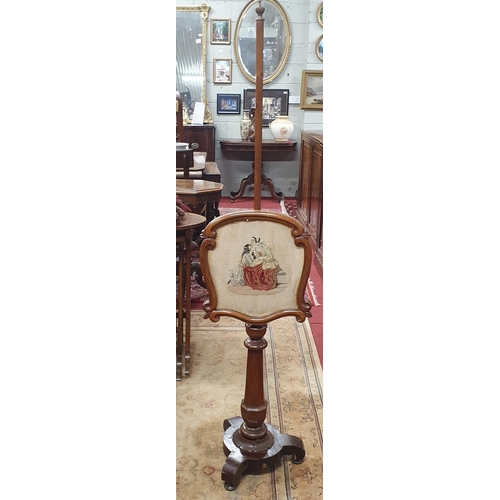 289 - An early 19th Century Mahogany Pole Screen with tapestry insert on platform base.
H 153 x W 36 cm ap... 