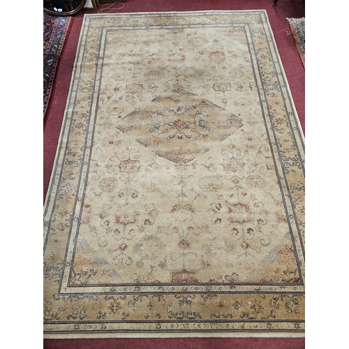 295 - A Royal Keshan cream ground Carpet with multi borders and repeating central medallion design 297 x 2... 