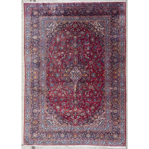 312 - A large Persian Tabriz red ground Rug with unique central medallion design and multi borders. (sligh... 