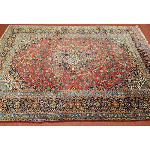 312 - A large Persian Tabriz red ground Rug with unique central medallion design and multi borders. (sligh... 