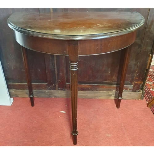 365 - A reproduction Mahogany half moon Table on turned supports. H 74 x W 77 x D 44 cm approx.