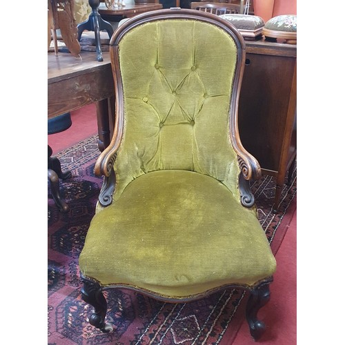 416 - An early 19th Century Rosewood showframe Salon Chair with deep buttoned back carved arms and carved ... 