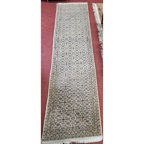 441 - A good cream ground Runner with multi borders and unique repeating central medallion design.
 310 x ... 