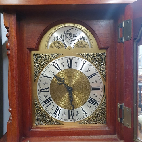 443 - A reproduction Mahogany Moonroller Longcase Clock with brass and steel dial. W 40 x H 174 cm approx.