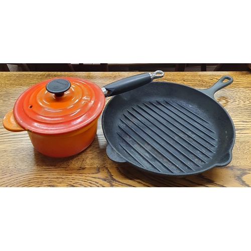 469 - A quantity of Le Creuset items to include two bowls, a small dish, a pot along with a griddle pan.