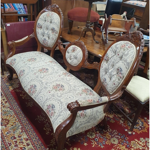 487 - A Mahogany showframe Lovers Seat with tapestry style upholstery and carved cabriole front supports a... 