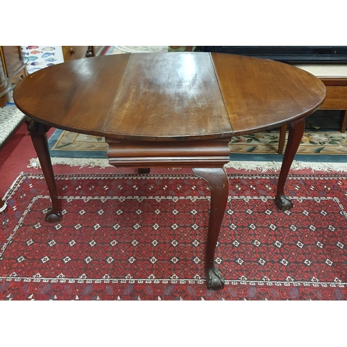 511 - A 19th Century Mahogany Drop Leaf Table with carved cabriole ball and claw supports. 99 x 128.5 x H ... 