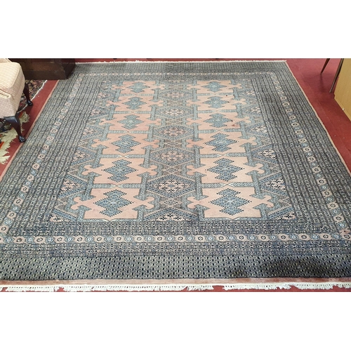 515 - A Pink ground Carpet with repeating central medallion design and multi borders. 304 x 250 cm approx.