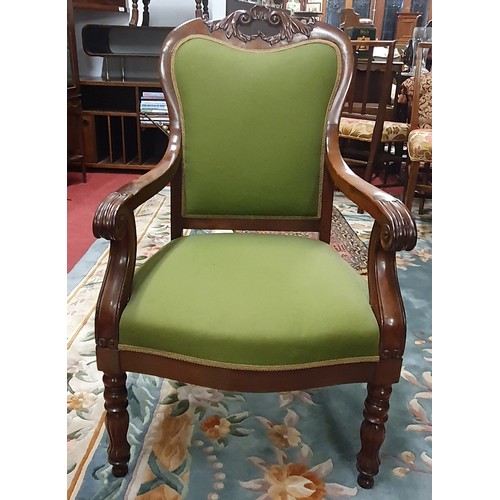 533 - A superb pair of 19th Century Mahogany Armchairs with highly carved back and fronts on turned fluted... 