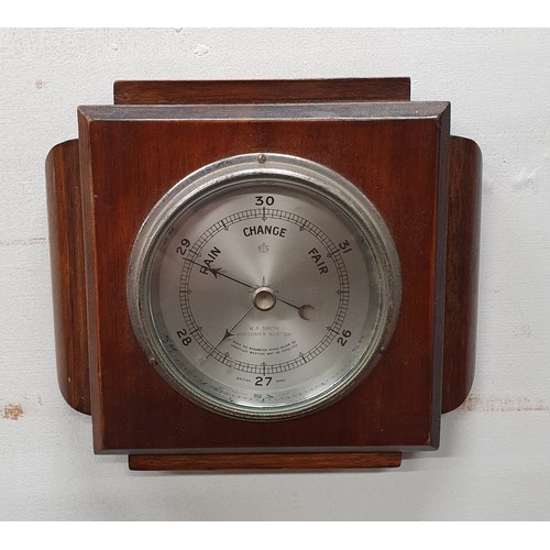 534 - An early 20th Century arts and crafts style wall aneroid Barometer. 17 x 19 cm approx.