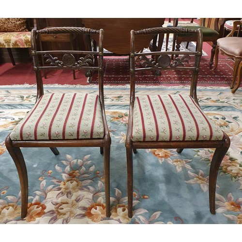 570 - A pair of Regency style Dining Chairs with sabre leg front. W 50 x SH 47 x BH 80 cm approx.