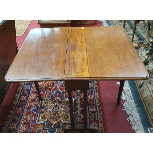 589 - A 19th Century Mahogany Sutherland Table on turned supports and slat ends. 84 x 98 x H 65 cm approx.