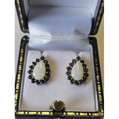 618 - A pair of 9ct Gold, Opal and Sapphire cluster Earrings.