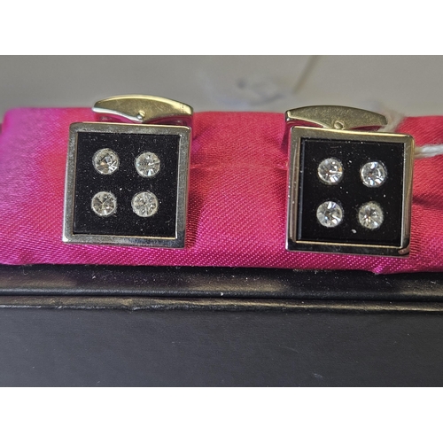 619 - A pair of P D Man Cufflinks.