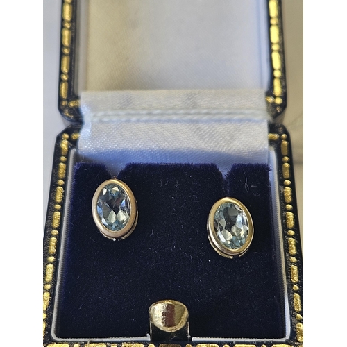 626 - A pair of 9ct Gold and Topaz Earrings.