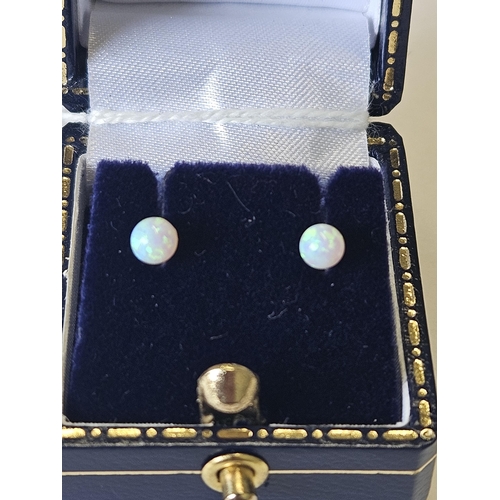 638 - A pair of 9ct Gold and Opal ball Earrings.