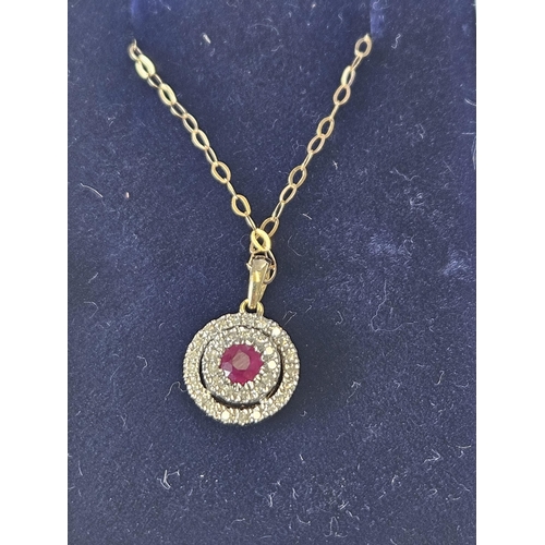 640 - A 9ct Gold, Diamond and Ruby target Pendant and 9ct Gold chain.