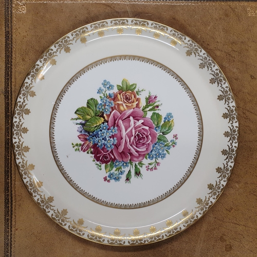 703 - A lovely Limoges Rehausse Main cake Plate with hand painted floral decoration.  D 30 cm approx.