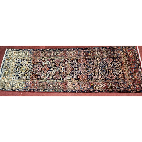 744A - A deep ground woven Iranian Runner with an all over traditional design from the Hamadan region of Ir... 