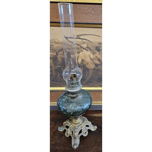 748 - An Art Nouveau Brass and glass Oil Lamp with Blue glass Bowl and funnel. H 53 cm approx.