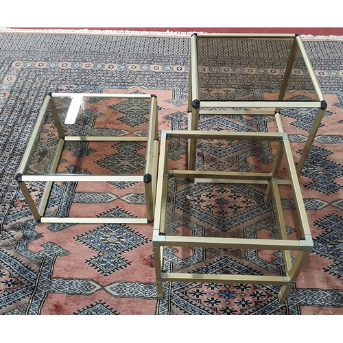 796 - A Matched graduated set of 3 Glass top Retro Tables. Largest H 42 x W 42 x D 42 cm approx.