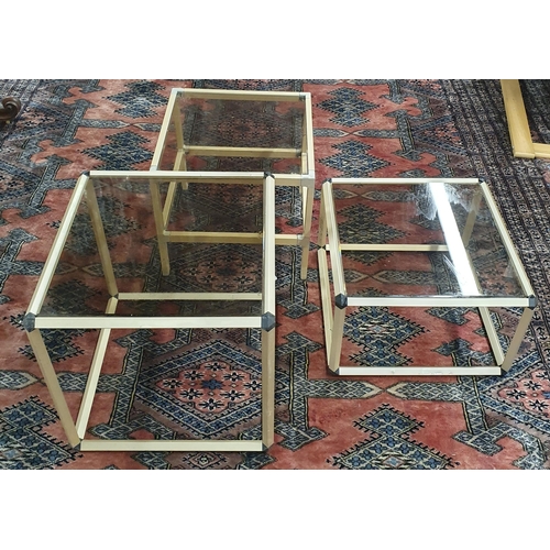 796 - A Matched graduated set of 3 Glass top Retro Tables. Largest H 42 x W 42 x D 42 cm approx.