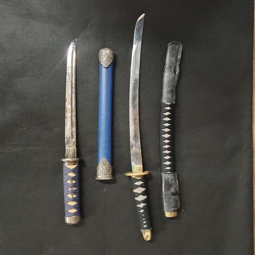 810 - Three Oriental prop Swords and Scabbards.
Largest L 114 cm approx.