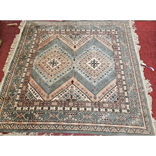 12 - A green ground Carpet with multi borders and unique central medallion design. 200 x 216cm approx.