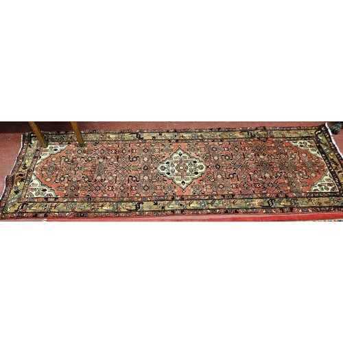 18 - A hand woven Persian Runner with a central medallion design from the Hamadan region of Iran. 300 x 1... 