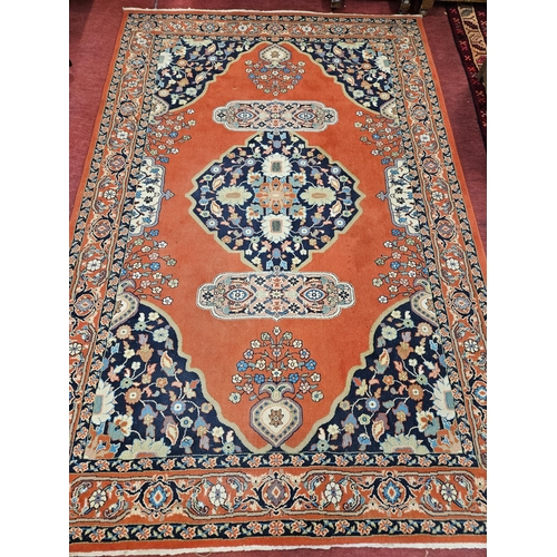 34 - A Persian style rust ground Carpet with multi borders and unique repeating central design. 200 x 300... 