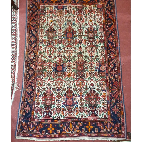 35 - A Persian red ground Rug with multi borders and unique medallion design 208cm x 136cm approx.