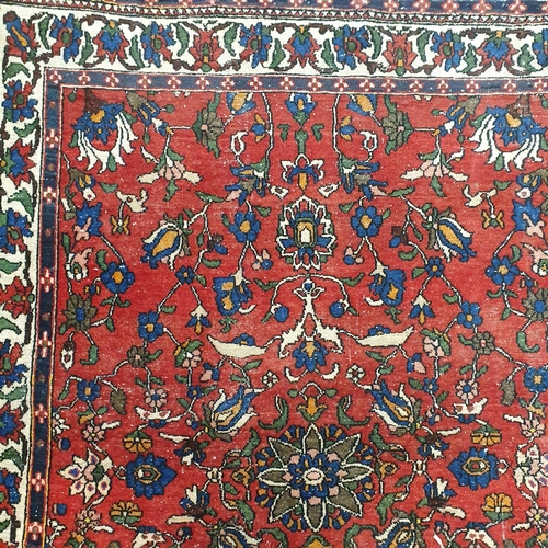 43 - A Persian Red ground Rug. 195 x 149 cm approx.