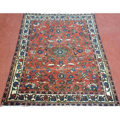 43 - A Persian Red ground Rug. 195 x 149 cm approx.